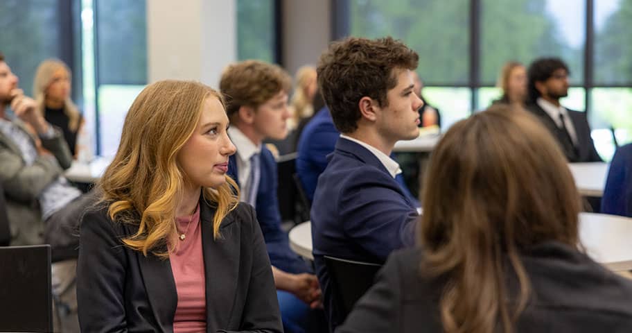 Industry leaders and executives partnering with Walton College at a naming event