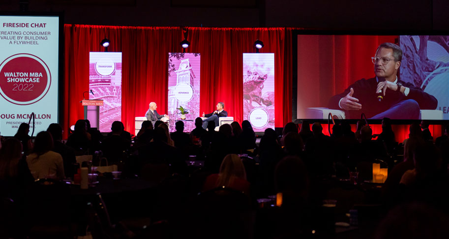 Walton College Dean Matt Waller and Walmart CEO Doug McMillon during a fireside chat-style conversation at the 2022 Walton MBA Showcase.