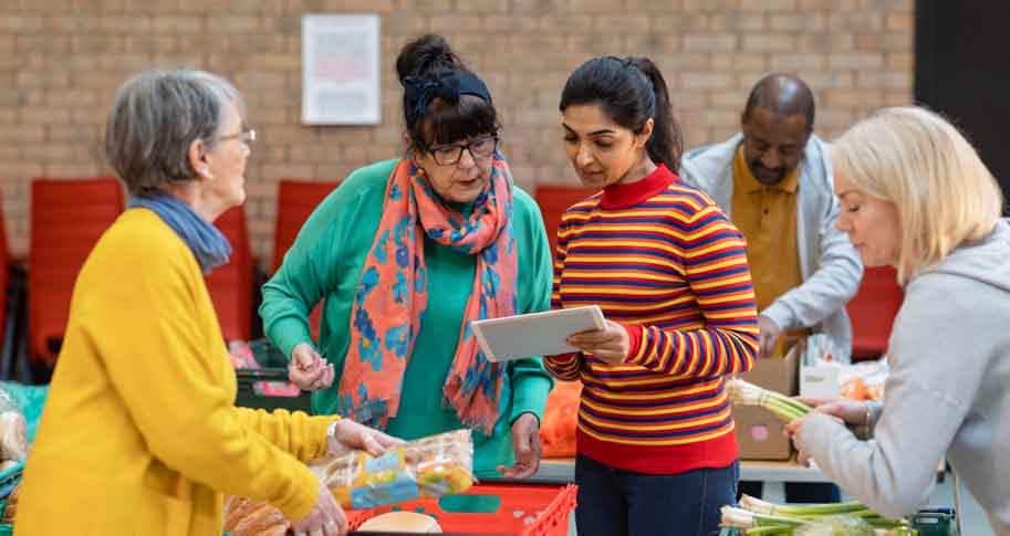 Women speaking together at a food bank