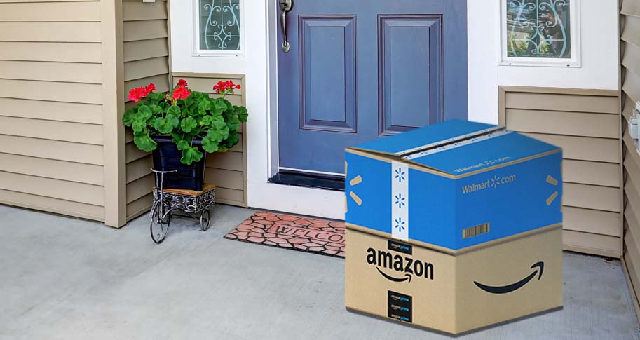 Amazon and Walmart shipping boxes on a porch 