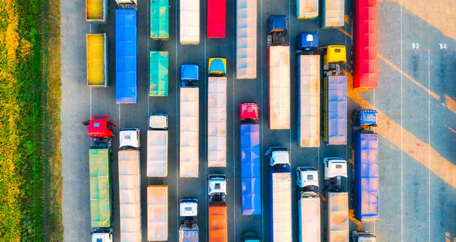 Semi trucks on a highway; Walton Insights article: "Market or Roadway Mayhem? A Fundamental Supply Chain Dilemma"