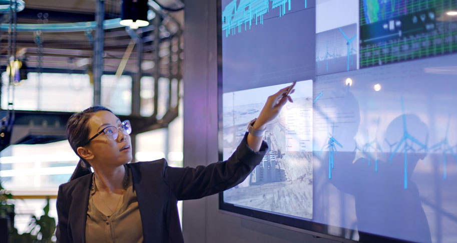 Woman pointing at a screen