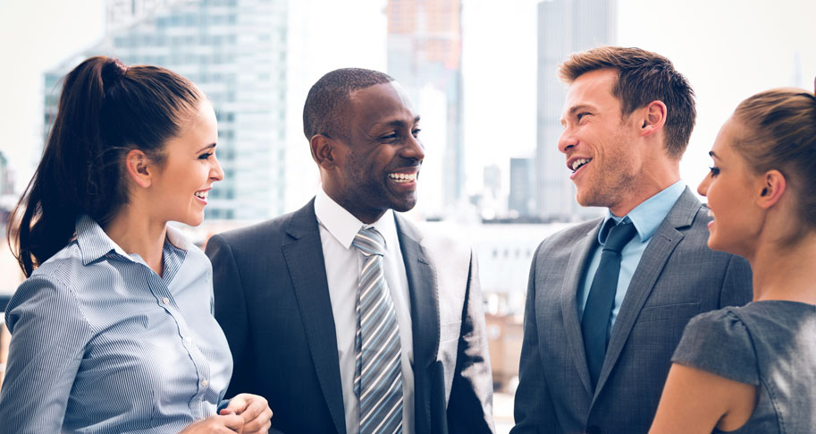 Group of 4 business people chatting