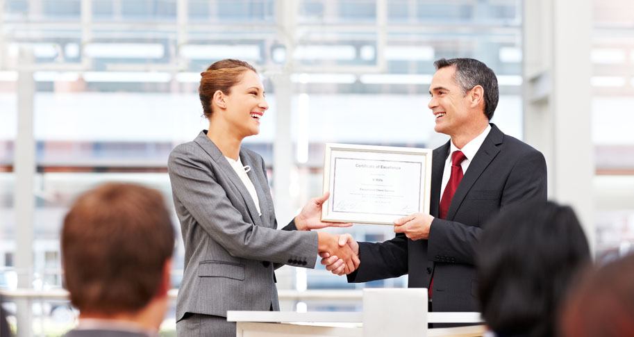 Businesswoman receiving graduate certificate 