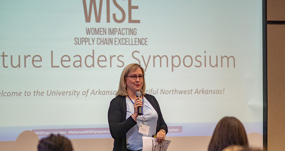 Stephanie Thomas welcomes guests at a previous WISE Future Leaders Symposium.