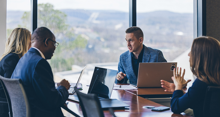 Walton College graduate students work on an MBA project.