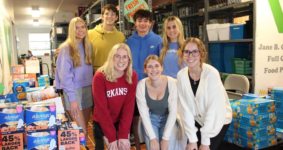 Group of students with food pantry items