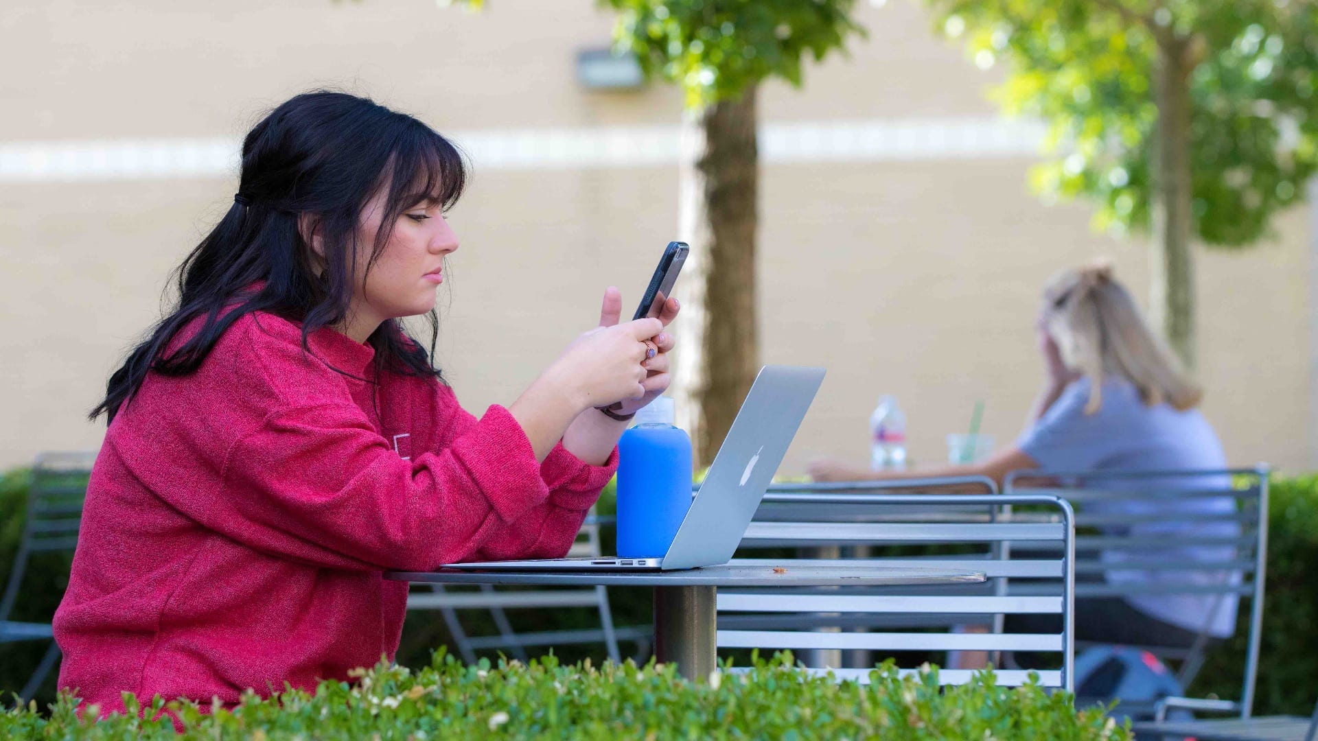 Student with Phone and Laptop