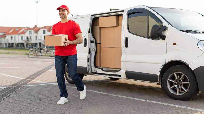 Delivery man carries package