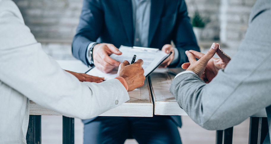 3 individuals discussing loan application