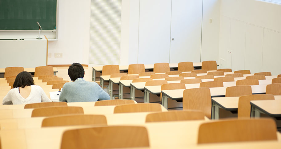 Students working in empty classroom