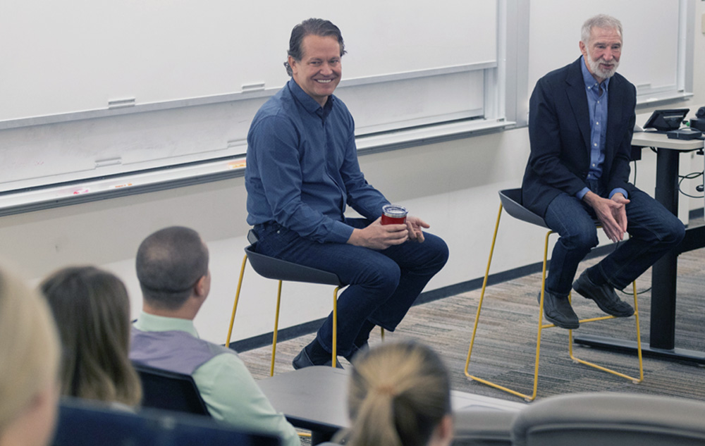 John Furner, President and Chief Executive Officer of Walmart U.S. and Walton College professor Jon Johnson speak to a class.