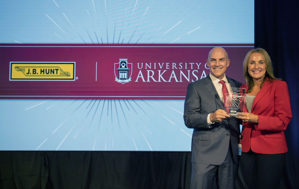 Former Walton College Dean, Matt Waller and J.B. Hunt Transport Services Inc. President, Shelley Simpson.